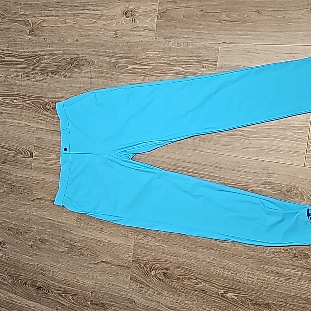 High-end dress pants in a large/34 waist, turquoise blue
